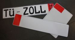 Ausfuhrkennzeichen Mehrere Kennzeichen, eines beschriftet mit TÜ-ZOLL und besonderer Randmarkierung